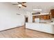 Kitchen with island, wood cabinets, and breakfast bar at 9748 W Peakview Dr, Littleton, CO 80123