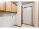 Laundry room with upper cabinets, washer and dryer hookups at 9748 W Peakview Dr, Littleton, CO 80123