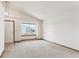 Living room with carpeted floor and bay window at 9748 W Peakview Dr, Littleton, CO 80123