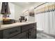 Modern bathroom with sleek vanity, contemporary fixtures, and elegant shower curtain at 6603 Canyonpoint Rd, Castle Pines, CO 80108