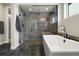 Stylish bathroom showcasing a glass-enclosed shower and soaking tub at 6603 Canyonpoint Rd, Castle Pines, CO 80108