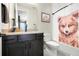 Charming bathroom featuring a vanity with storage, a toilet, and a shower with a decorative curtain at 6603 Canyonpoint Rd, Castle Pines, CO 80108