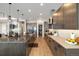 Spacious kitchen with a large island, stainless steel appliances, and modern lighting at 6603 Canyonpoint Rd, Castle Pines, CO 80108