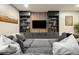 Cozy living room featuring a comfortable seating area and a custom entertainment center at 6603 Canyonpoint Rd, Castle Pines, CO 80108