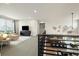 Open concept living room and dining room with a view of the kitchen from the second story at 6603 Canyonpoint Rd, Castle Pines, CO 80108