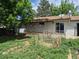 Backyard featuring a wood pergola, lawn, and patio area at 17900 E Asbury Dr, Aurora, CO 80013