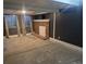 Finished basement features a brick fireplace, window and neutral wall color at 17900 E Asbury Dr, Aurora, CO 80013