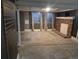Spacious basement area features a brick fireplace, window and grey walls at 17900 E Asbury Dr, Aurora, CO 80013