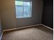 Bedroom featuring a neutral wall color and carpet flooring at 17900 E Asbury Dr, Aurora, CO 80013