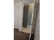 Hallway with tile flooring and open doorways, offering easy movement and connectivity at 17900 E Asbury Dr, Aurora, CO 80013