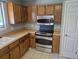 Bright kitchen with stainless steel oven, microwave and tile backsplash at 17900 E Asbury Dr, Aurora, CO 80013