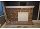 Living room featuring a brick fireplace with white trim and a window to the left at 17900 E Asbury Dr, Aurora, CO 80013