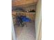 Interior of the shed showing useful storage with a purple bike and blue tarp at 17900 E Asbury Dr, Aurora, CO 80013