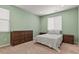 Serene bedroom with neutral tones, natural light, and ample space for relaxation and rest at 16099 Alberta Dr, Parker, CO 80134