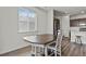 Bright dining area featuring a traditional table and chairs, with lots of natural light and modern flooring at 16099 Alberta Dr, Parker, CO 80134