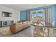 Inviting living room with a shiplap accent wall, large windows, and a comfortable seating area at 16099 Alberta Dr, Parker, CO 80134