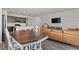 Open-concept living space with a large kitchen island, dining area, and comfortable living room at 16099 Alberta Dr, Parker, CO 80134
