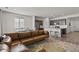 Spacious open-concept living area with kitchen, dining area, and comfortable seating, perfect for entertaining at 16099 Alberta Dr, Parker, CO 80134