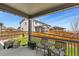 Covered patio overlooking the backyard and fence; the perfect outdoor relaxation spot at 16099 Alberta Dr, Parker, CO 80134