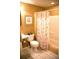 Bright bathroom featuring a tiled floor, toilet, sink, and bathtub with decorative shower curtain at 9926 Apollo Bay Way, Highlands Ranch, CO 80130