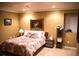 Comfortable bedroom with floral bedding, wooden furniture, carpet, and classic decor, offering a cozy retreat at 9926 Apollo Bay Way, Highlands Ranch, CO 80130