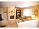 Inviting living room with fireplace, built-in shelving, neutral color palette, and comfortable seating at 9926 Apollo Bay Way, Highlands Ranch, CO 80130