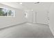 Finished basement with carpet flooring, bright natural light and neutral paint at 4102 W Union Ave, Denver, CO 80236