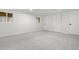 Finished basement with carpet flooring, bright natural light and neutral paint at 4102 W Union Ave, Denver, CO 80236