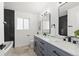 Modern bathroom features dual sinks, marble countertops, and a sleek design at 4102 W Union Ave, Denver, CO 80236