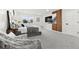 Serene bedroom with a comfy bed, large windows, and a decorative accent wall at 4102 W Union Ave, Denver, CO 80236