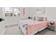 Bright bedroom with carpeted floors, a large window and neutral paint at 4102 W Union Ave, Denver, CO 80236