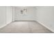 Bright bedroom with carpeted floors, a large window and neutral paint at 4102 W Union Ave, Denver, CO 80236