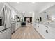 Modern kitchen with stainless steel appliances, granite countertops, and an open layout at 4102 W Union Ave, Denver, CO 80236