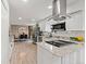 Beautiful open kitchen with granite countertops and stainless steel appliances overlooking the dining area at 4102 W Union Ave, Denver, CO 80236