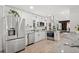 Bright kitchen with stainless steel appliances, white cabinets, and granite countertops at 4102 W Union Ave, Denver, CO 80236