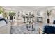 Open concept living area with bar seating, stainless steel appliances, and ample seating at 4102 W Union Ave, Denver, CO 80236