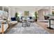 Inviting living room with area rug, modern furniture, and neutral color palette at 4102 W Union Ave, Denver, CO 80236