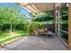 Charming backyard patio area with outdoor dining and lush greenery, offering a private and serene outdoor retreat at 4258 Tennyson St # 101, Denver, CO 80212