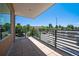 A spacious outdoor balcony with black metal railings, offering scenic city views and ample space for relaxation at 4258 Tennyson St # 101, Denver, CO 80212