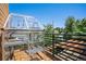 Outdoor space with a greenhouse-like structure and wooden deck, perfect for gardening and enjoying the outdoors at 4258 Tennyson St # 101, Denver, CO 80212