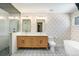 Modern bathroom featuring double vanity, walk-in shower, and stylish patterned flooring at 4258 Tennyson St # 101, Denver, CO 80212