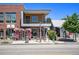 Attractive mixed-use building with brick facade, wood accents, and inviting storefront at 4258 Tennyson St # 101, Denver, CO 80212
