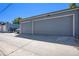 Spacious two-car garage with modern gray doors and ample driveway parking, complemented by well-maintained exterior at 4258 Tennyson St # 101, Denver, CO 80212