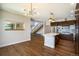 Spacious open kitchen and dining area with modern lighting, stainless appliances, and center island at 4258 Tennyson St # 101, Denver, CO 80212