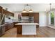 Updated kitchen with stainless steel appliances and center island at 4258 Tennyson St # 101, Denver, CO 80212