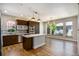 Modern kitchen boasts stainless steel appliances, quartz countertops, and a stylish center island at 4258 Tennyson St # 101, Denver, CO 80212