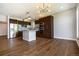 Open kitchen and dining space with stainless steel appliances and hardwood flooring at 4258 Tennyson St # 101, Denver, CO 80212