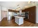 Modern kitchen featuring stainless steel appliances, a center island, and stylish lighting at 4258 Tennyson St # 101, Denver, CO 80212