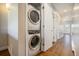 Convenient laundry closet featuring a stackable washer and dryer, maximizing space in this well-designed home at 4258 Tennyson St # 101, Denver, CO 80212