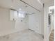 Unfinished basement with laundry hookups, utility closet, and a window at 4844 Vallejo St, Denver, CO 80221